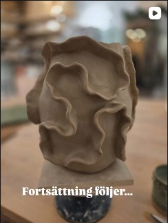 A sculptural vase with flowing ceramic folds, photographed in Lisa’s studio.